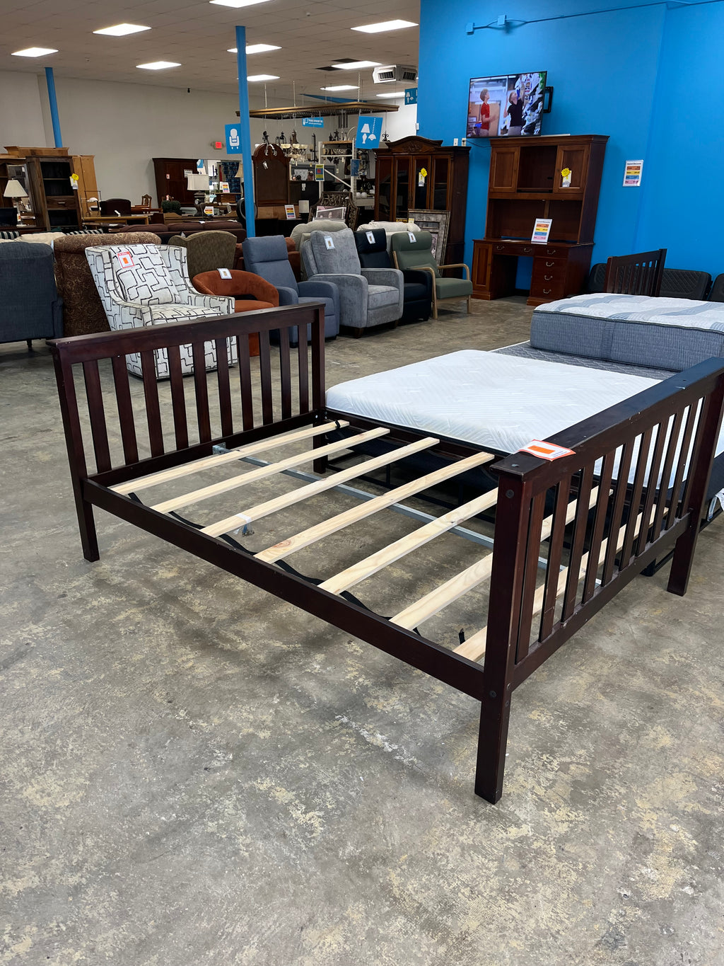 dark wooden full bedframe